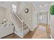 Welcoming foyer featuring a staircase, hardwood floors, neutral walls, and an elegant entryway at 437 Buttermere Rd # 31, Fort Mill, SC 29715