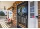 Cozy front porch with comfortable seating, decorative wreath, and a Ring doorbell for added security at 437 Buttermere Rd # 31, Fort Mill, SC 29715