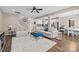 Spacious living room with hardwood floors, plush seating, and an open view to the kitchen and staircase at 437 Buttermere Rd # 31, Fort Mill, SC 29715