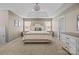 Tranquil main bedroom features a tray ceiling, plush carpet, and ample natural light at 437 Buttermere Rd # 31, Fort Mill, SC 29715