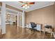 Open-concept office with hardwood floors, neutral walls, and a view into the dining room at 437 Buttermere Rd # 31, Fort Mill, SC 29715