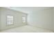 Bright bedroom with neutral walls, carpet, and windows with shutter blinds at 4930 Park Phillips Ct, Charlotte, NC 28210