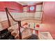 Grand foyer featuring a staircase with decorative railing, hardwood floors, and elegant lighting fixtures at 4930 Park Phillips Ct, Charlotte, NC 28210