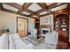 Spacious living room with a fireplace, coffered ceilings, and hardwood floors at 4930 Park Phillips Ct, Charlotte, NC 28210