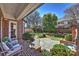 Charming patio with brick accents, a fountain, and serene landscaping at 4930 Park Phillips Ct, Charlotte, NC 28210