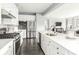 Modern kitchen featuring white cabinets, stainless steel appliances, and a kitchen island at 496 Kenyon Dr, Denver, NC 28037