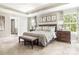 Bedroom featuring a large bed, windows, and ensuite bathroom at 496 Kenyon Dr, Denver, NC 28037