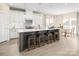 Bright kitchen featuring a gray island with bar stool seating and stainless steel appliances at 497 Kenyon Dr, Denver, NC 28037