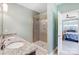 Bathroom featuring granite-topped dual sink vanity and glass shower at 5252 Admirals Lndg, Lancaster, SC 29720