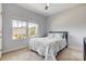Well-lit bedroom with a decorative bed and a pair of windows at 5252 Admirals Lndg, Lancaster, SC 29720