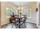 Bright dining room with large windows and a rustic wooden table at 5252 Admirals Lndg, Lancaster, SC 29720