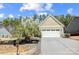 Charming single-Gathering home with a manicured lawn, palm tree, and an attached two-car garage at 5252 Admirals Lndg, Lancaster, SC 29720