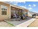Back exterior of house with sunroom, patio, and backyard grilling area at 5252 Admirals Lndg, Lancaster, SC 29720