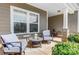 Relaxing front porch area with comfortable seating and decorative lanterns at 5252 Admirals Lndg, Lancaster, SC 29720