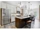 Open kitchen with a large island, granite countertops, and stainless steel appliances at 5252 Admirals Lndg, Lancaster, SC 29720