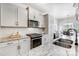 Modern kitchen with granite countertops, stainless steel appliances, and white cabinets at 5252 Admirals Lndg, Lancaster, SC 29720
