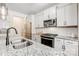 Modern kitchen with granite countertops, stainless steel appliances, and white cabinets at 5252 Admirals Lndg, Lancaster, SC 29720