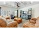 Spacious living room with coffered ceiling, comfortable seating, and ample natural light at 5252 Admirals Lndg, Lancaster, SC 29720