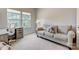 Bright living room with modern furnishings and a large window offering a street view at 5252 Admirals Lndg, Lancaster, SC 29720