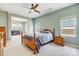 Airy main bedroom with a ceiling fan, connecting to a sunroom for relaxing at 5252 Admirals Lndg, Lancaster, SC 29720