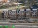 Aerial view of brick townhomes, showcasing their proximity to roadways and urban surroundings at 530 N Mcdowell St, Charlotte, NC 28204