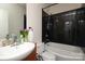 Modern bathroom with sleek black tile shower, granite countertop, and contemporary fixtures at 530 N Mcdowell St, Charlotte, NC 28204