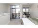 Bedroom includes a dedicated workspace and a private balcony with sliding glass doors at 530 N Mcdowell St, Charlotte, NC 28204