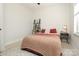 Bright bedroom featuring a cozy bed with stylish bedding, a unique shelf, and a window for natural light at 530 N Mcdowell St, Charlotte, NC 28204