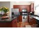 Well-equipped kitchen featuring wood cabinets, stainless steel appliances, and ample counter space at 530 N Mcdowell St, Charlotte, NC 28204