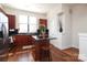 Bright kitchen featuring dark wood cabinets, black countertops, stainless steel appliances and central island with seating at 530 N Mcdowell St, Charlotte, NC 28204