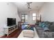 Bright living room featuring hardwood floors, modern furniture, and large windows offering natural light at 530 N Mcdowell St, Charlotte, NC 28204