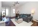 Cozy living room with modern gray sofa, natural light, hardwood floors, and stylish décor at 530 N Mcdowell St, Charlotte, NC 28204