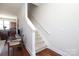 Interior staircase leading to the upper level, featuring carpeted steps and a white handrail at 530 N Mcdowell St, Charlotte, NC 28204