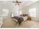 Main bedroom with neutral colors, vaulted ceiling, ceiling fan and abundant of natural light at 6520 Fieldstone Manor Dr, Matthews, NC 28105