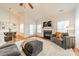 Bright living room with vaulted ceilings, a fireplace, and large windows overlooking the outdoor view at 6520 Fieldstone Manor Dr, Matthews, NC 28105