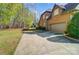 Long, paved driveway leads to a well-maintained two-story brick home and attached garage at 6548 Robin Hollow Dr, Mint Hill, NC 28227