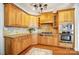 Updated kitchen featuring wood cabinets, granite countertops, and stainless steel appliances at 6548 Robin Hollow Dr, Mint Hill, NC 28227