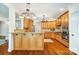 Spacious kitchen with wood cabinets, stainless steel appliances, and a breakfast bar at 6548 Robin Hollow Dr, Mint Hill, NC 28227