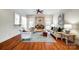 Bright living room with fireplace, arched windows, hardwood floors, and elegant decor at 6548 Robin Hollow Dr, Mint Hill, NC 28227