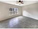 Spacious room with large window and tile flooring, ready for your personal touch at 7829 Buddy Holly Rd, Charlotte, NC 28216