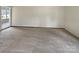 Living room with carpet flooring, large window, and neutral walls at 7829 Buddy Holly Rd, Charlotte, NC 28216