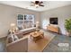 Bright living room with neutral tones and a large window for natural light at 7829 Buddy Holly Rd, Charlotte, NC 28216