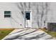 A backyard view of a back door, a window, an air conditioning unit and green grass at 81 Kirk St, Salisbury, NC 28144