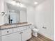Bathroom featuring a white vanity with granite counters and modern fixtures at 81 Kirk St, Salisbury, NC 28144