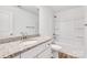 Bright bathroom featuring granite countertop, white vanity, and tub with shower at 81 Kirk St, Salisbury, NC 28144