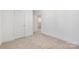 Neutral carpeted bedroom featuring white walls and a spacious closet at 81 Kirk St, Salisbury, NC 28144