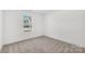Bright bedroom with neutral carpet, white walls and window with natural light at 81 Kirk St, Salisbury, NC 28144