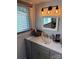 Well-lit bathroom with modern vanity, stylish fixtures, and a large window at 827 W Horah St, Salisbury, NC 28144