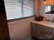 Modern bathroom vanity with bright lighting and a large window for natural light at 827 W Horah St, Salisbury, NC 28144