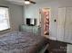 Bright bedroom featuring a ceiling fan and view of the adjacent bathroom at 827 W Horah St, Salisbury, NC 28144